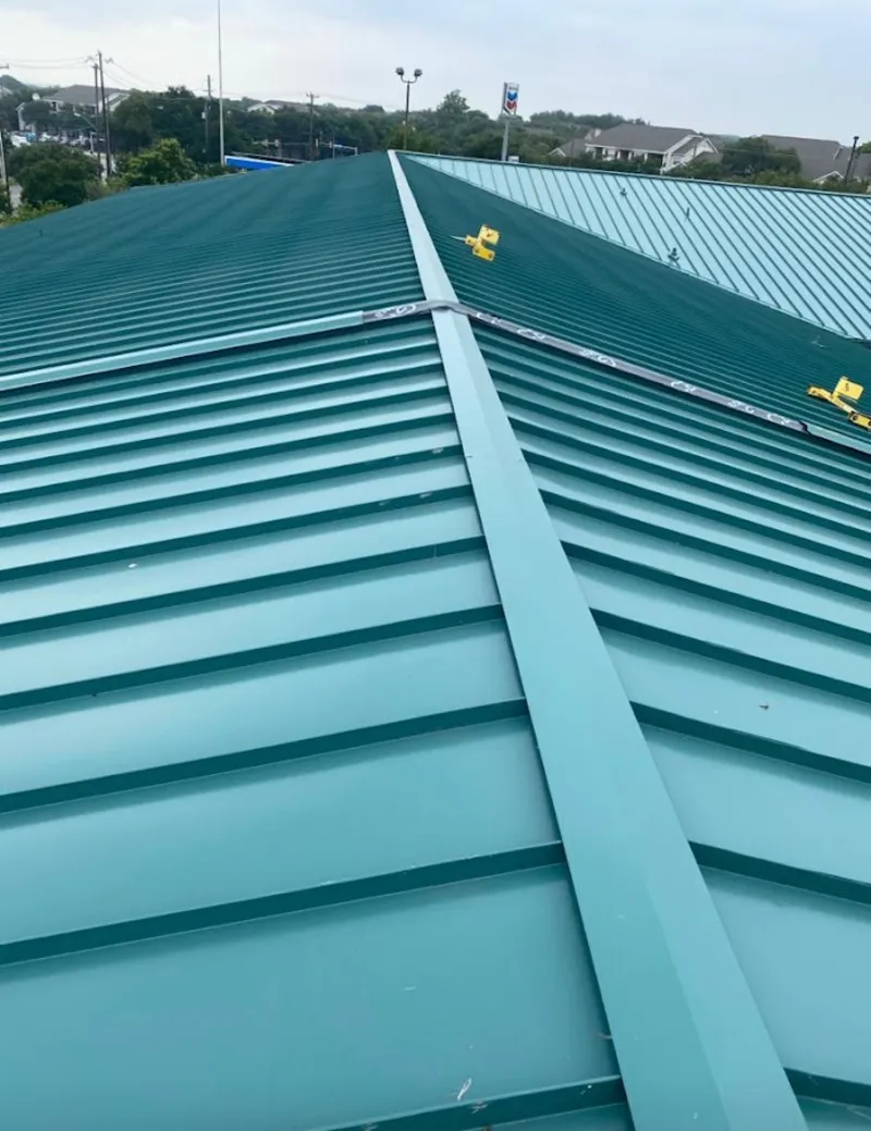 Green commercial metal roof ridge and valley for Metal Roof Repair in Great Falls
